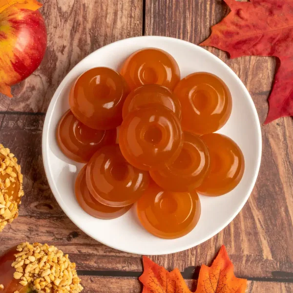 Firefly multiple transparent caramel colored gummies, smooth surface, stacked together, in round sha