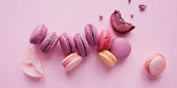 Sweet,French,Macarons,On,Pink,Background.