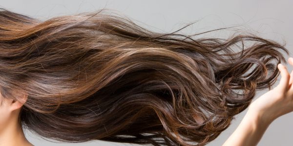 Lively,Hair,On,A,Gray,Background.