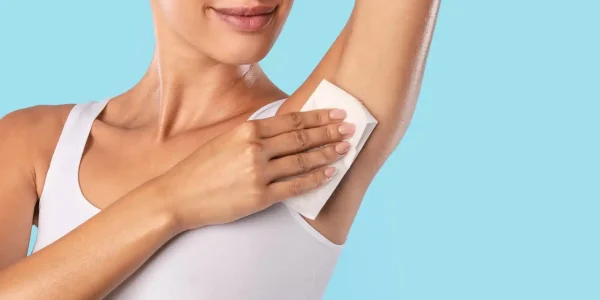 Hyperhidrosis,Concept.,Closeup,Cropped,View,Of,Young,Lady,Wiping,Her